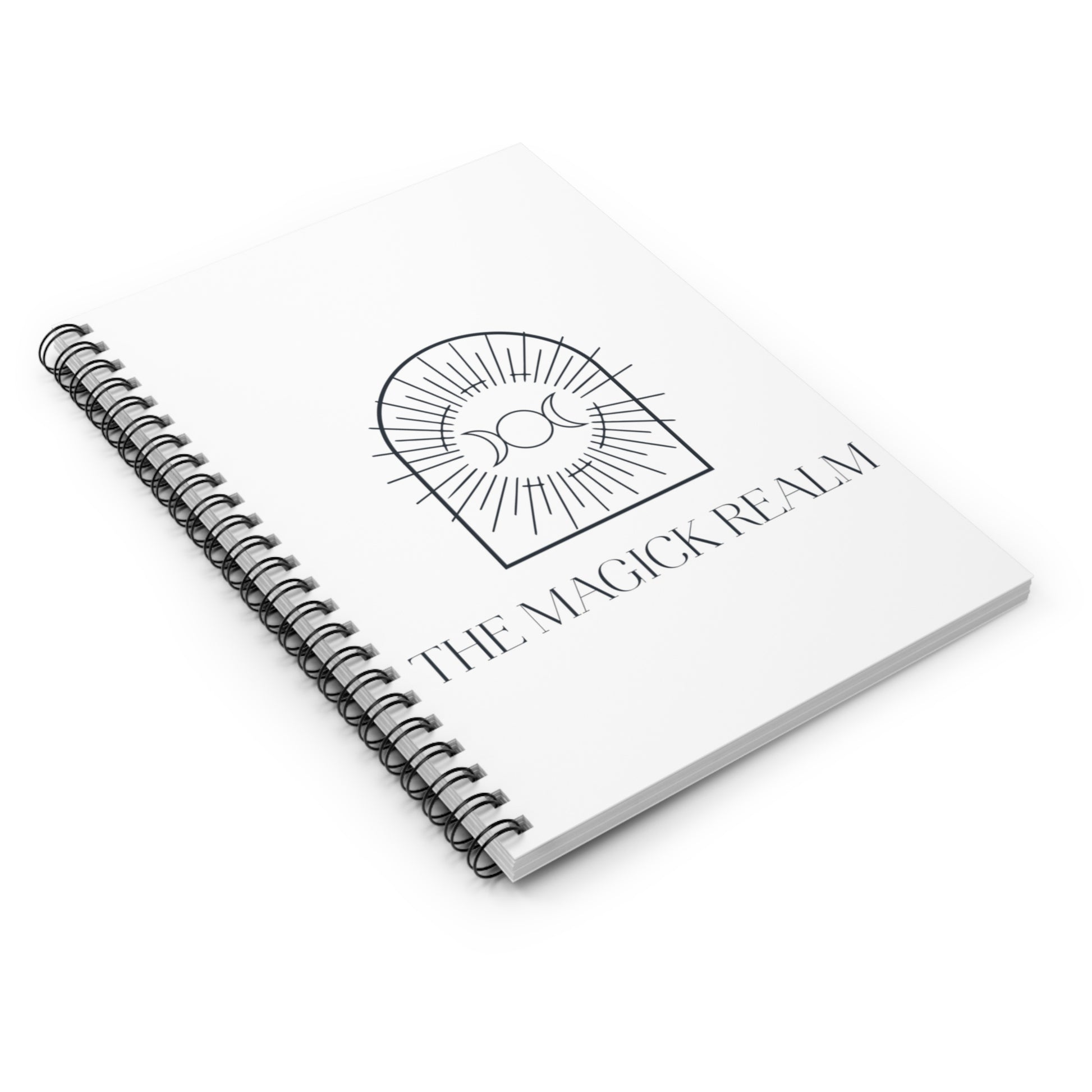 Spiral-bound notebook with 'The Magick Realm' logo on a white background