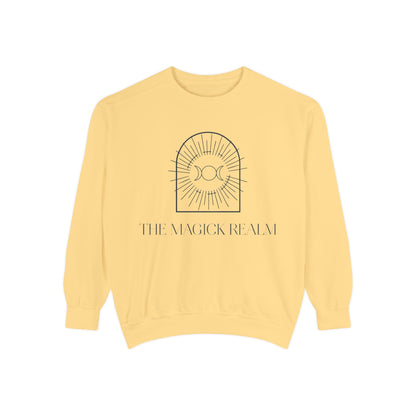 Yellow sweatshirt with 'The Magick Realm' logo on a white background