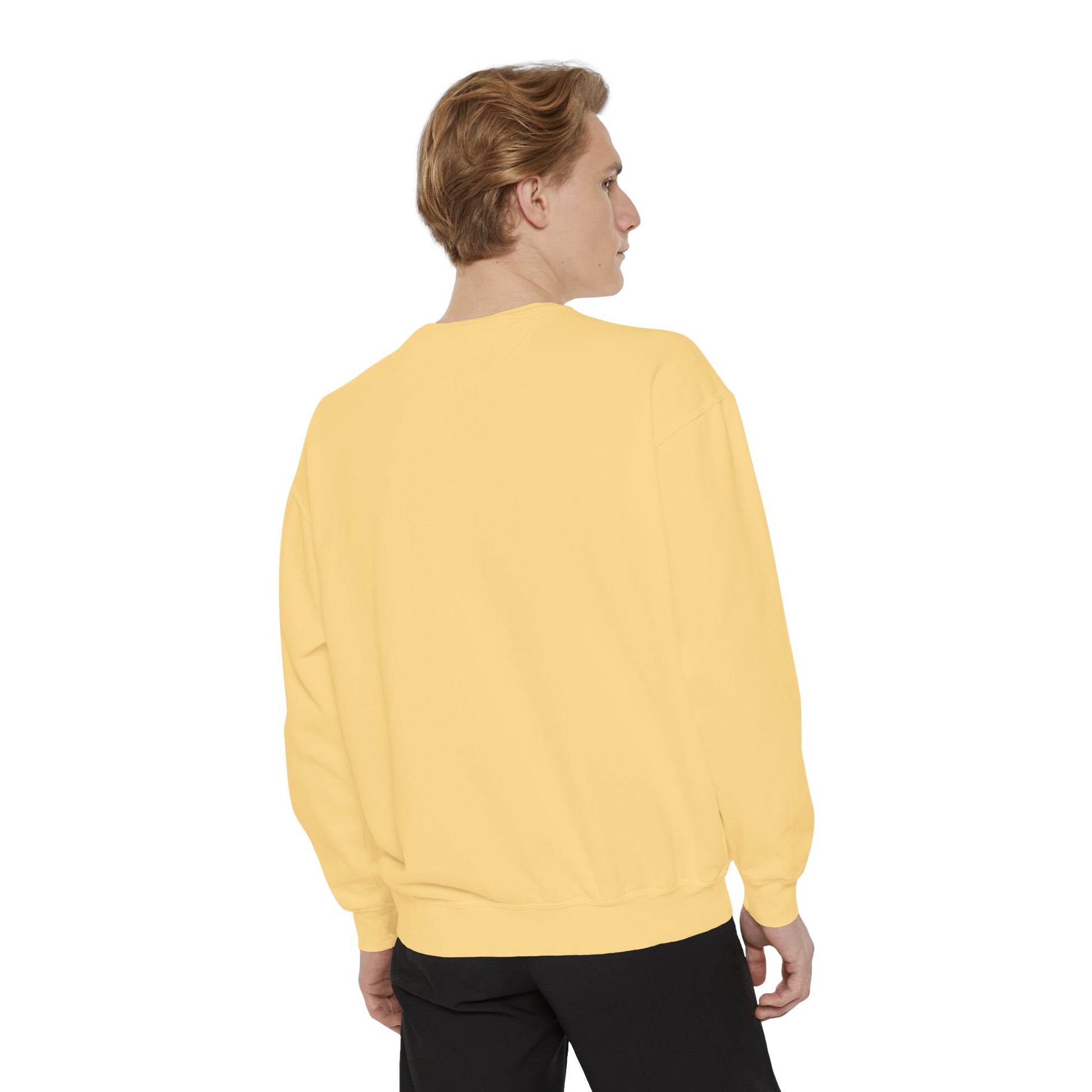 Person wearing a yellow sweater on a white background