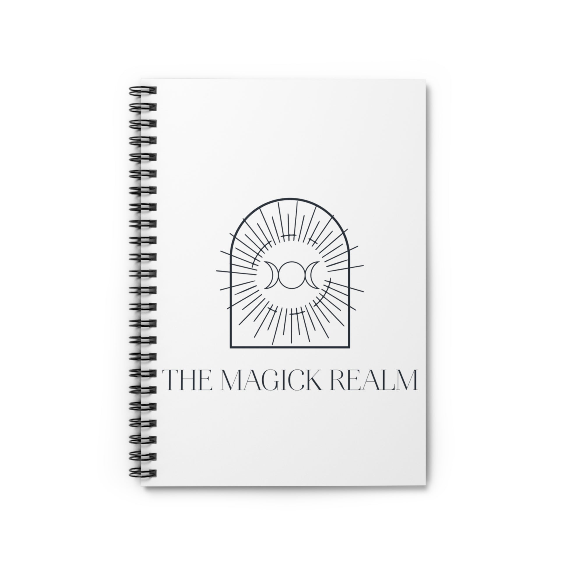 Notebook titled 'The Magick Realm' with a black and white design on a white background