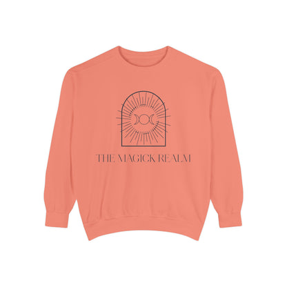 Coral sweatshirt with 'The Magick Realm' design on a white background