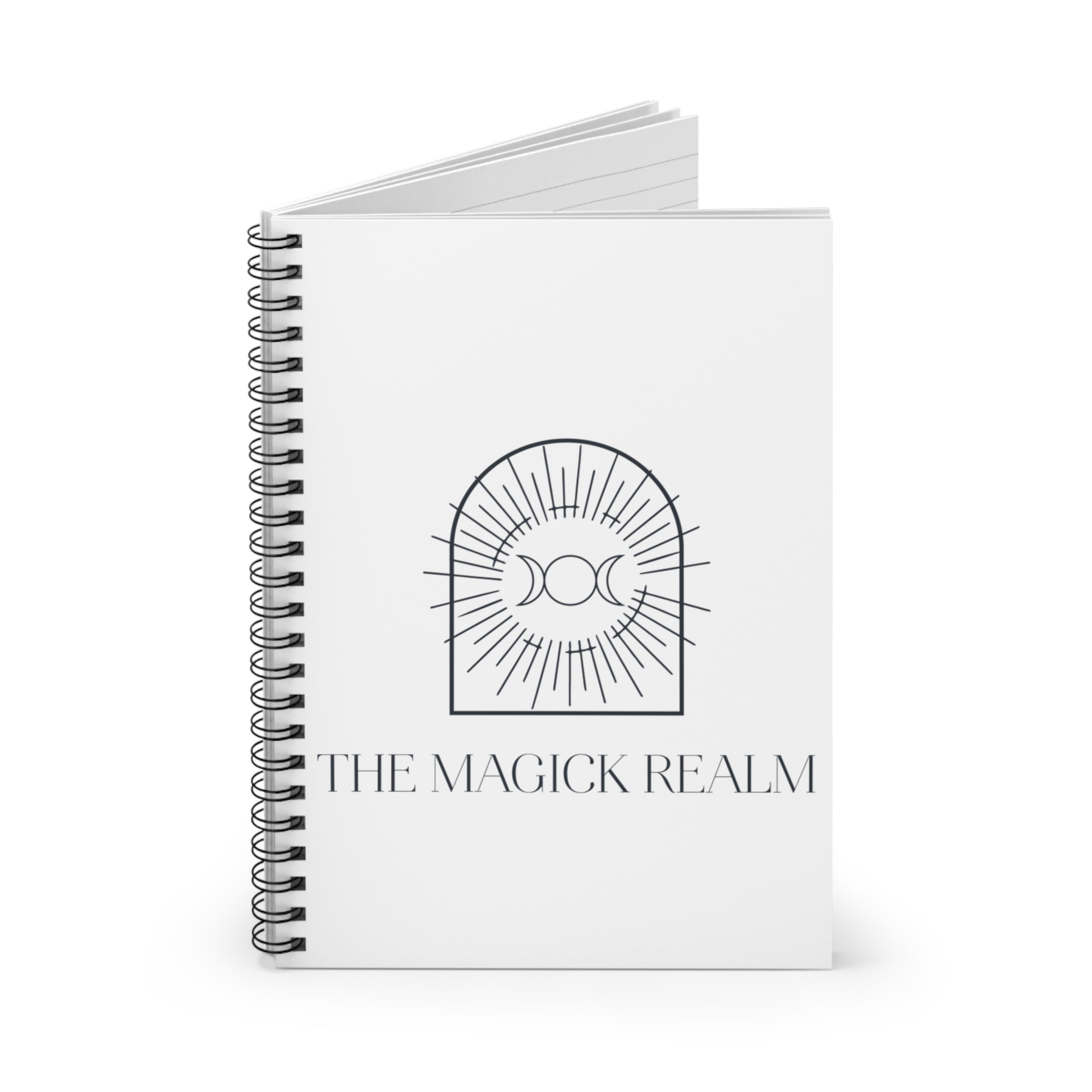 Notebook titled 'The Magick Realm' with a design on the cover against a white background