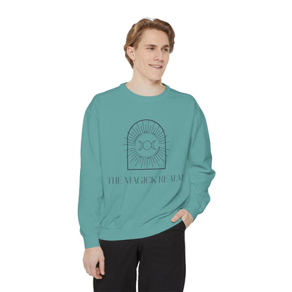 Person wearing a teal sweatshirt with a graphic design and text on a white background